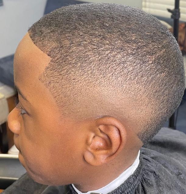 Young boy with a fresh fade haircut 
