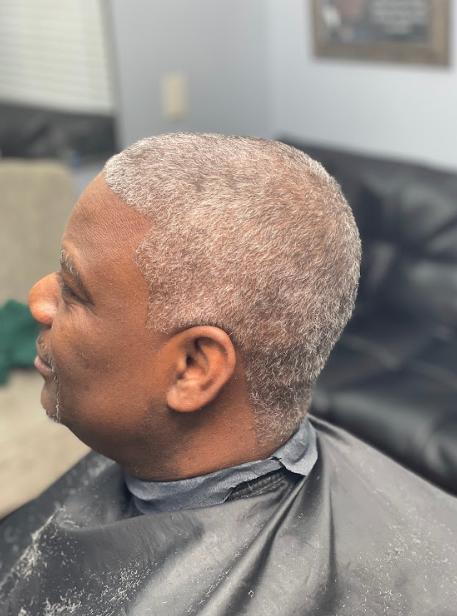 Man with a fresh haircut looking sharp after a professional barber service